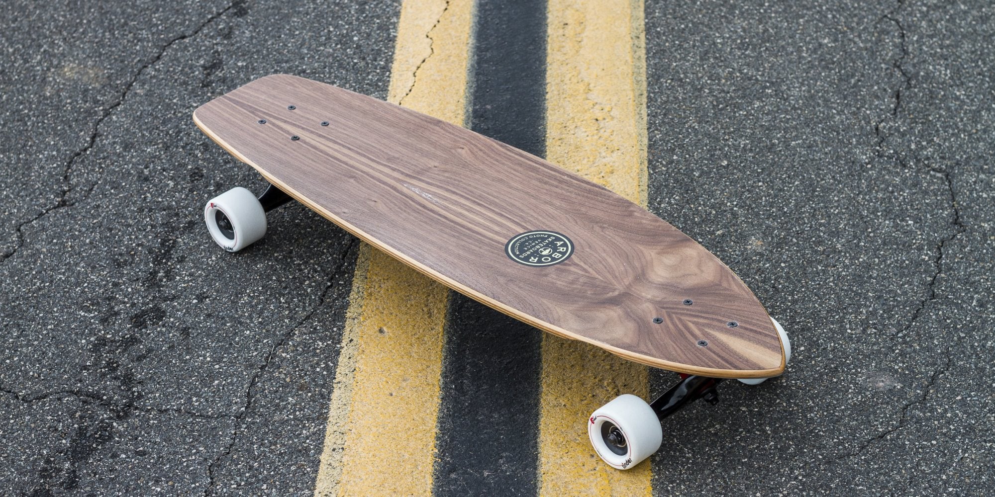 Arbor Rally longboard on street