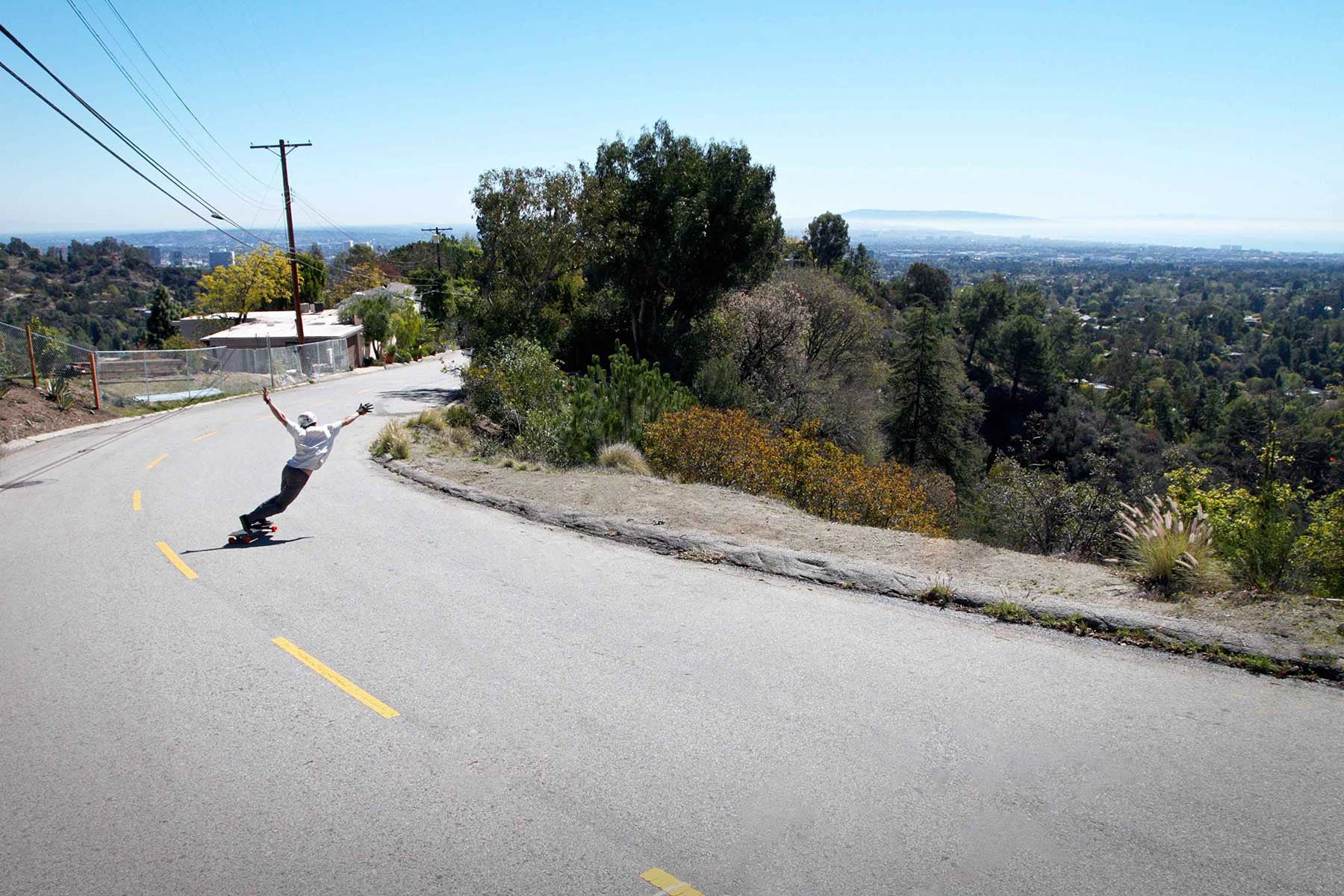 Fizz nails the drift on his longboard.