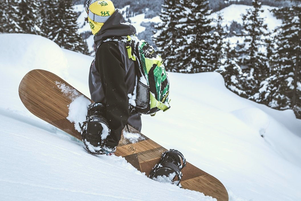 Loaded Snowboarder in Deep Snow