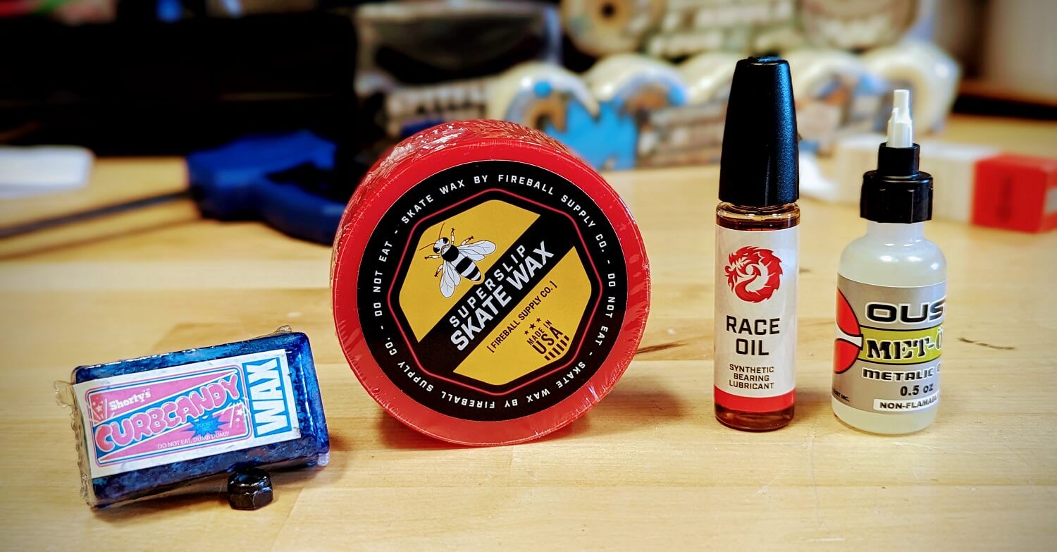 Skateboard wax bars are on the left and skateboard lubricants can be seen on the right.