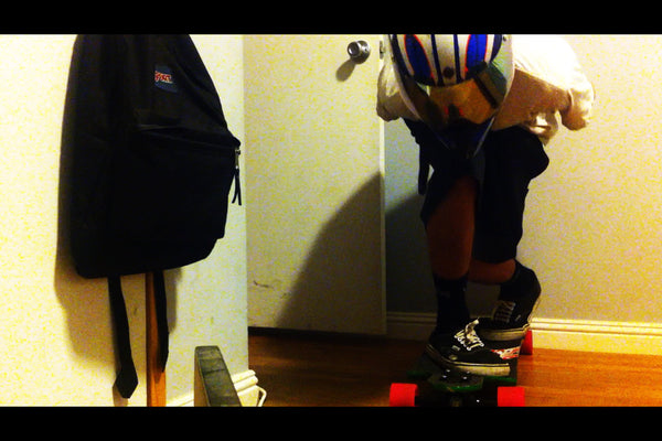Here you can see how the helmet is supposed to extend slightly past, or on top of, the front knee.