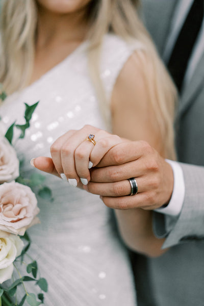 Couple with Custom Ebony Wood and Titanium Ring