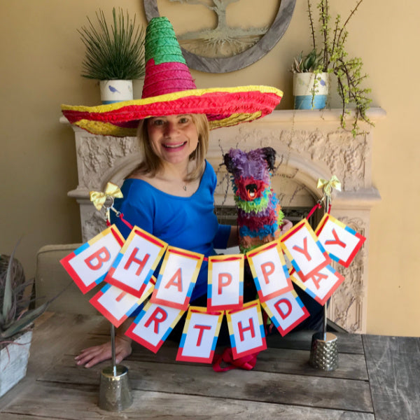 woman with beautiful birthday centerpiece from Birthday Butler.