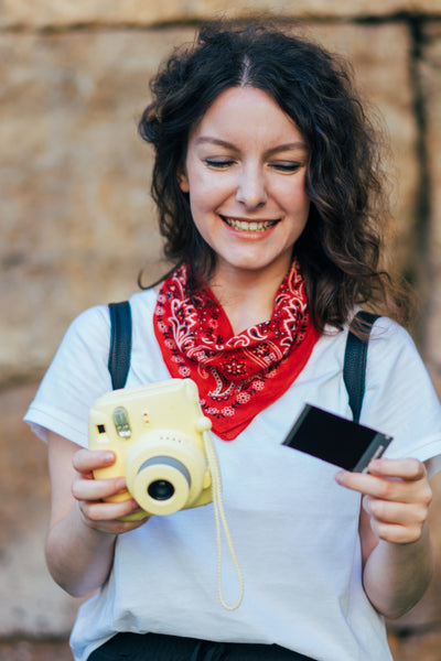 woman with polaroid camera