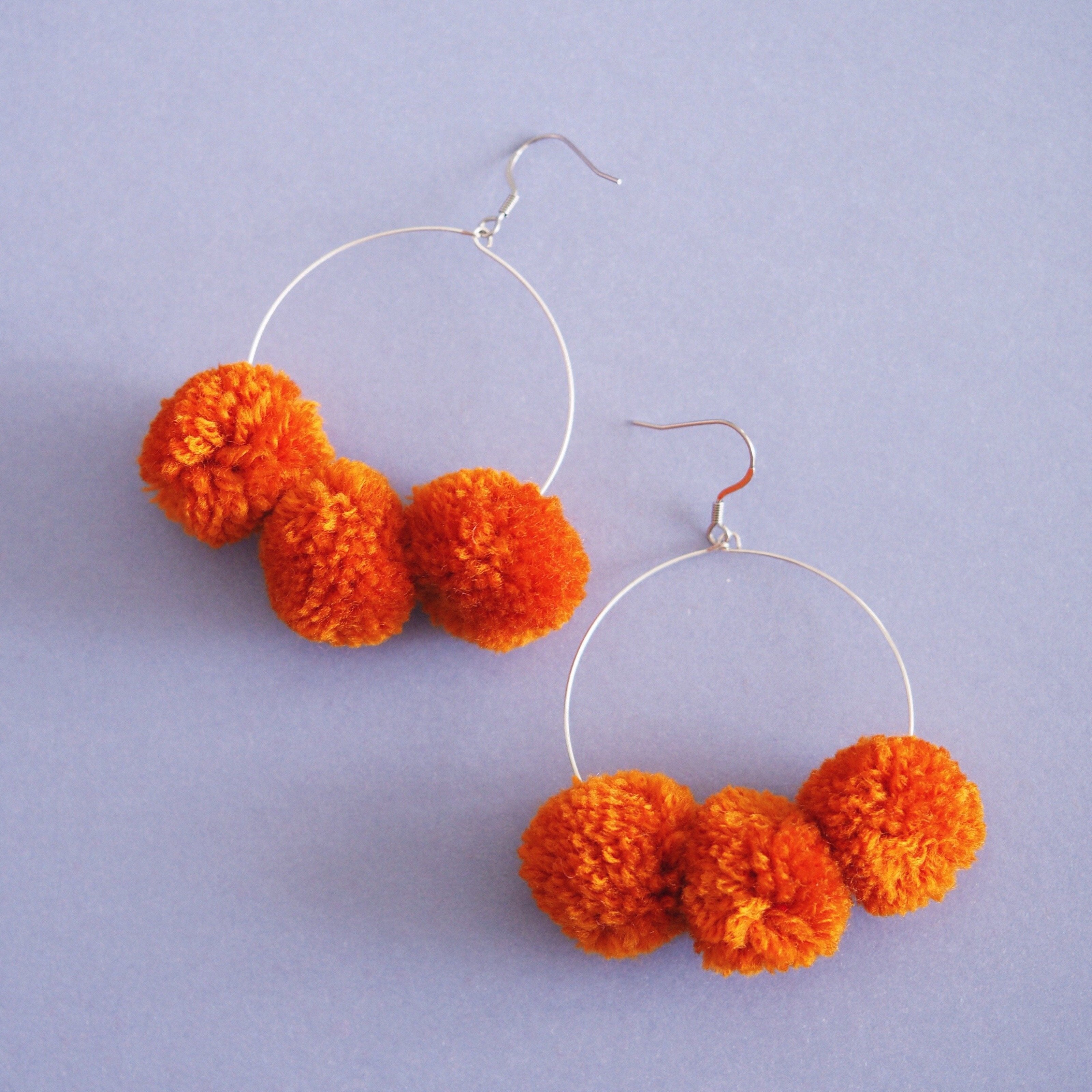 Betty pom pom earrings in Apricot –
