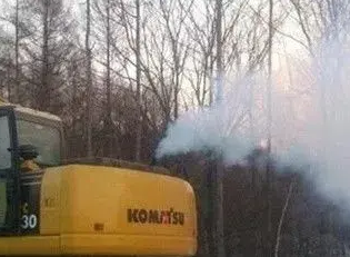 excavator blue smoke