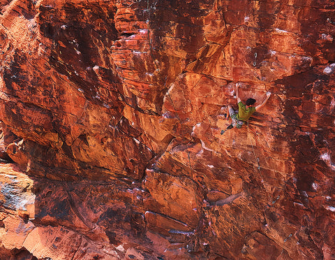 Craig DeMartino climbing on red rock with prosthetic leg image Pongoose blog