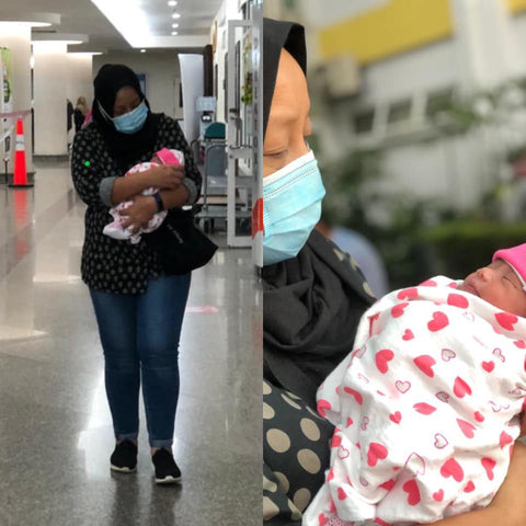 Puan Suraya bringing home a premature baby from hospital. 