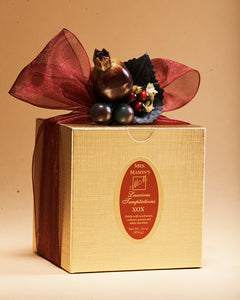 XOX Brittle in one pound gold gift box in Fall wrap