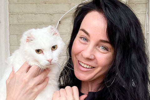Cat treated for cat acne with her foster mom