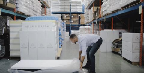 Man Removing Plastic From Mattress