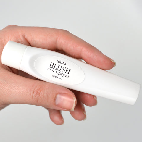 BLUSH Lacquers Cuticle Oil held in hand
