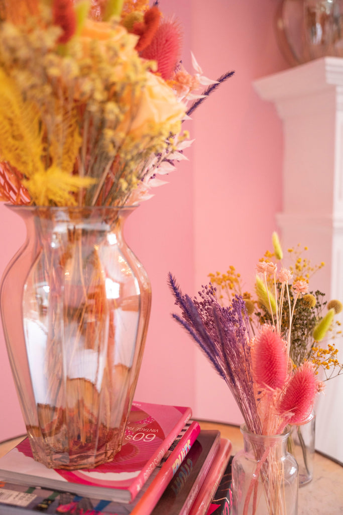 beautiful dried flower arrangement in clear vase and jar