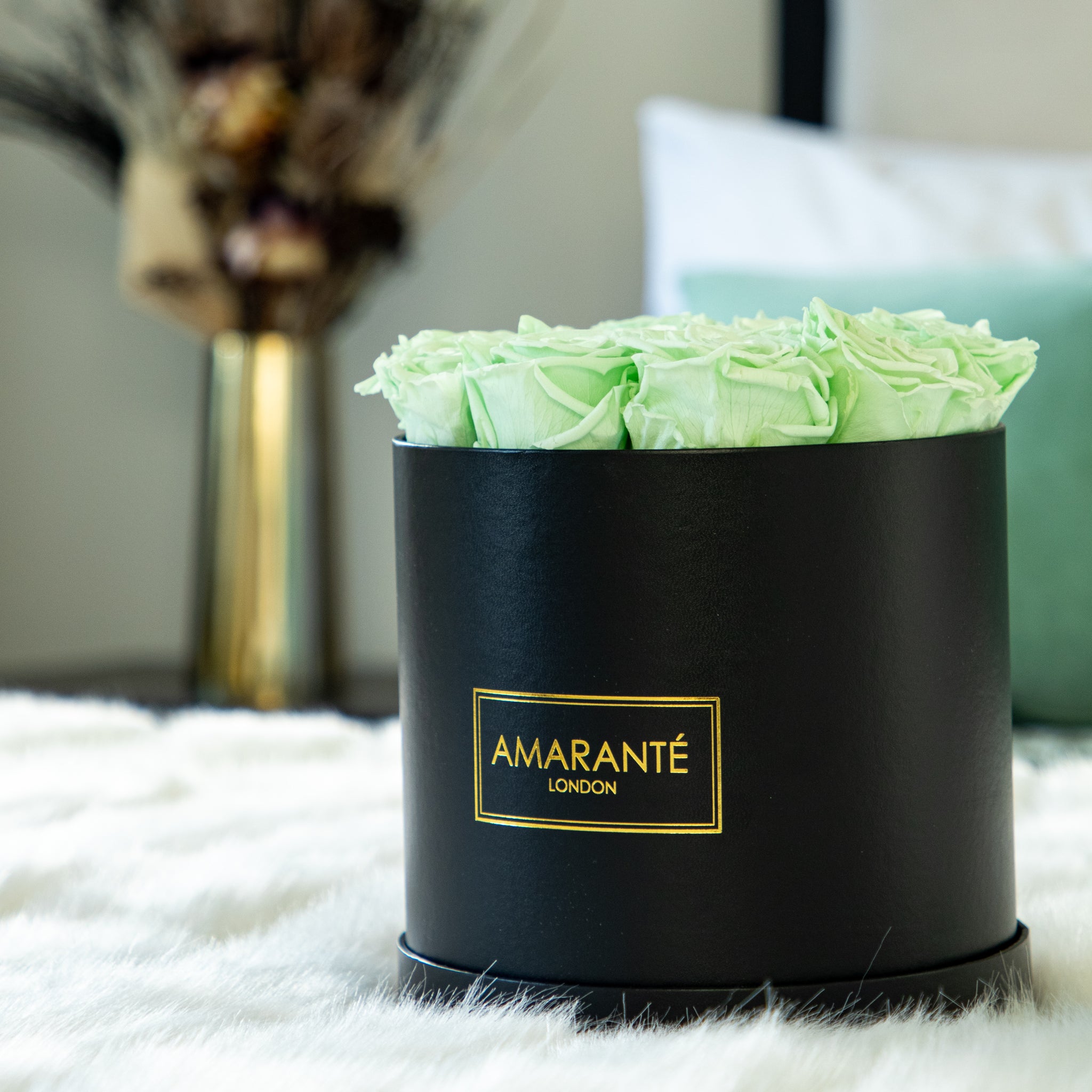 Relaxing Mint Green Infinity Roses in a  striking  black hatbox