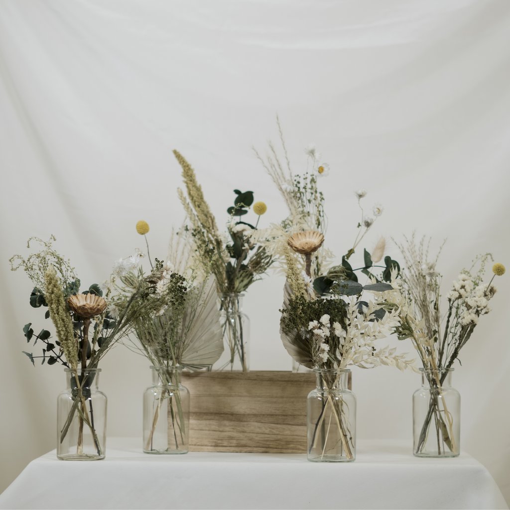 Gorgeous Christmas wedding flowers displayed in classic jars 