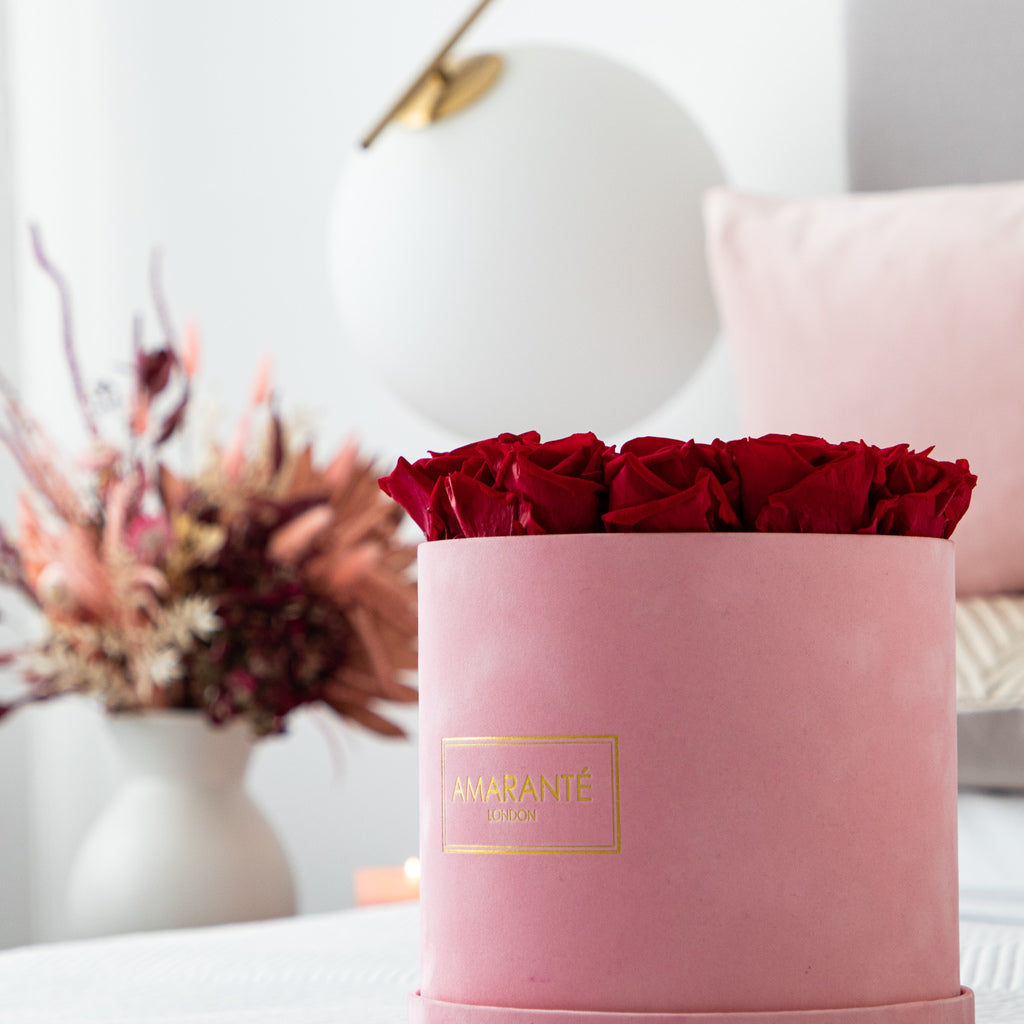 Divine wedding flower centrepieces in a dapper pink suede box