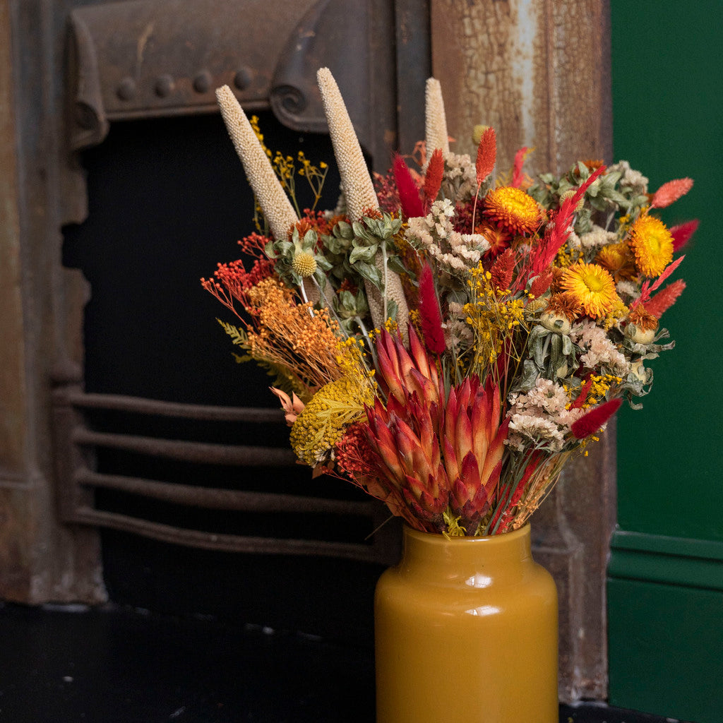 Enchanting preserved flower arrangements in a dapper vase