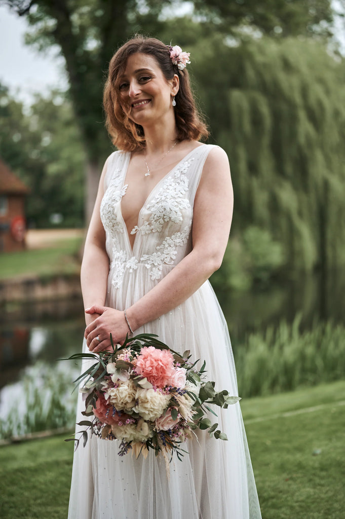 The Bride holding a soft colour bouquet