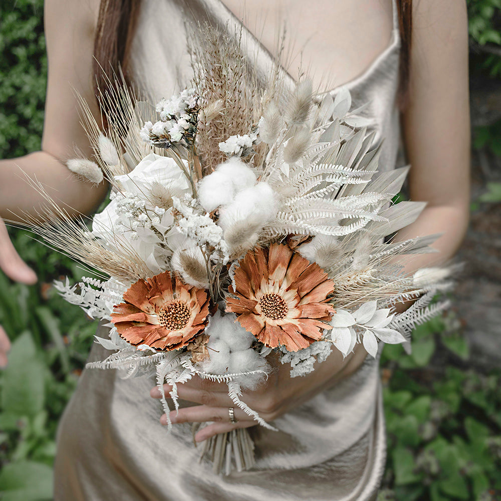 Luxury Bridesmaid Bouquet featuring white roses, perfectly woven within more eccentric and rustic stems and cotton
