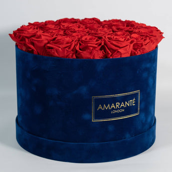 Beautiful Red Roses in blue round suede hatbox