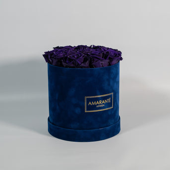 Purple eco flowers, roses in classic royal blue hatbox