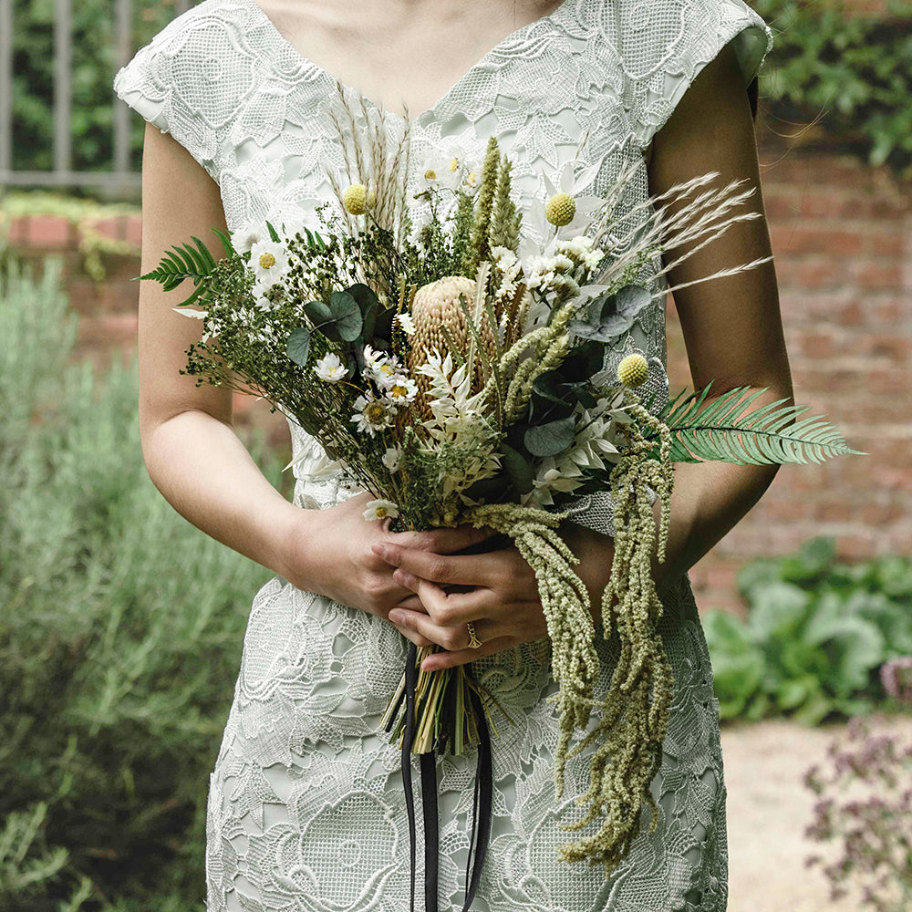 Bridesmaid bouquet that is toned down from our bridal bouquet but still has all the essential stems and colours to create a beautiful bouquet to replicate mother earth with carefully selected dried flowers and foliage.