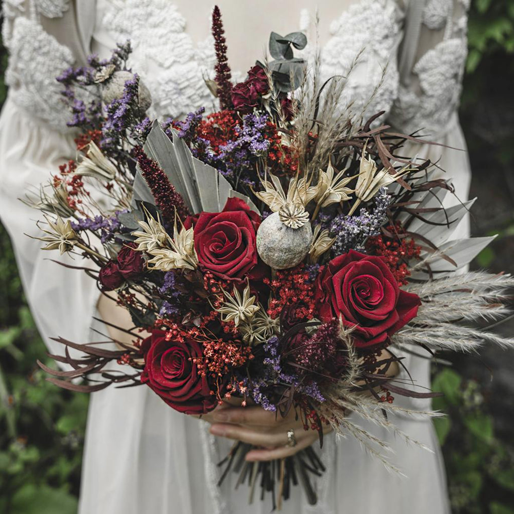 Luxury Bridesmaid Bouquet featuring large red roses and other unique dried flowers such as  pampas, nigella and red broom