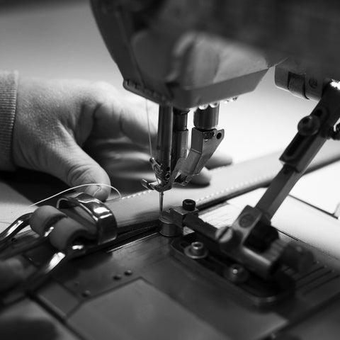 Stitching on the leather belts - Angus Barrett Saddlery