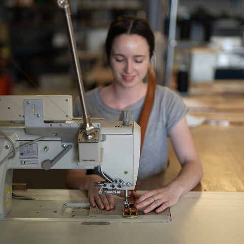 Emma sewing on the buckles and keepers to the belt