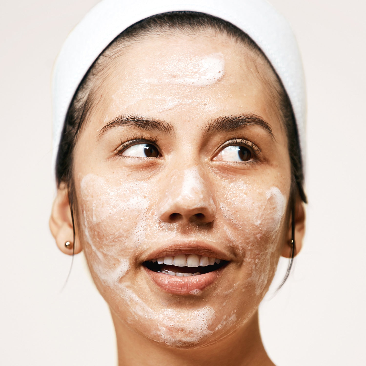 Woman using Exfoliating Jelly Cleanser