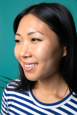 Asian girl with Mighty Patch on cheek