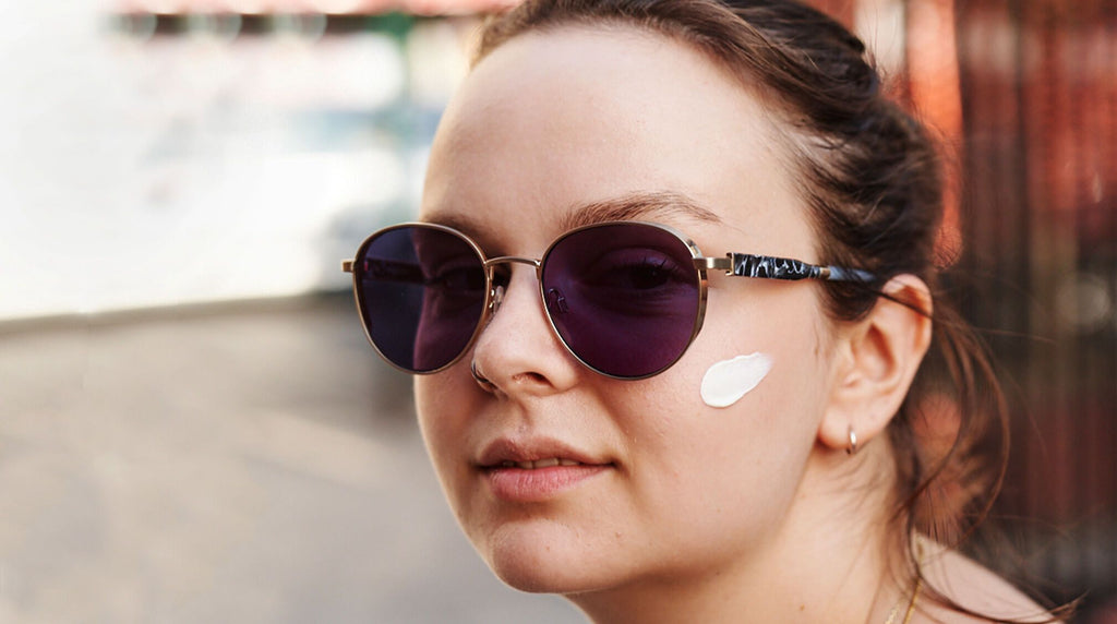 Rachel wearing sunscreen on face