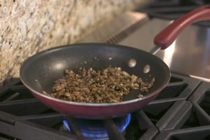 Using the same skillet the filet mignon cooked on, heat butter on medium-high heat. Add shallot and garlic, and stir for 30 seconds. Reduce heat to medium and add the remainder of the mushroom duxelles ingredients. Continue to stir, cooking until the mushrooms caramelize (5-10 minutes). Set aside. 