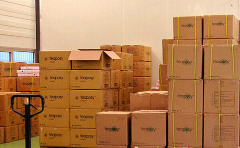 Cases of Teaposy products stacked up neatly in a warehouse