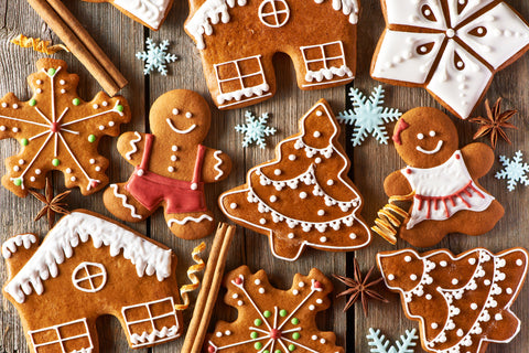 Gingerbread cookies arranged on a wooden background, showcasing their warm, festive charm.