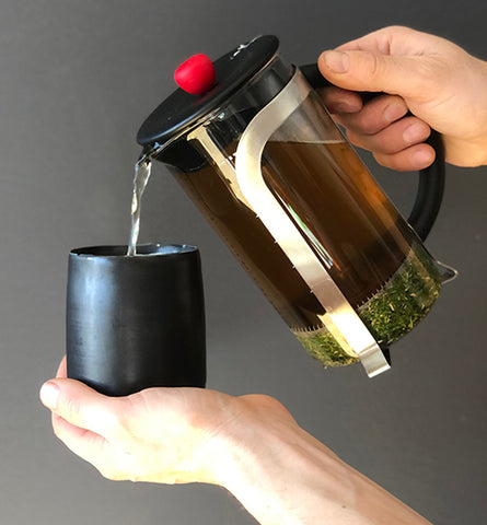 Herbal tea, loose herbs, mug