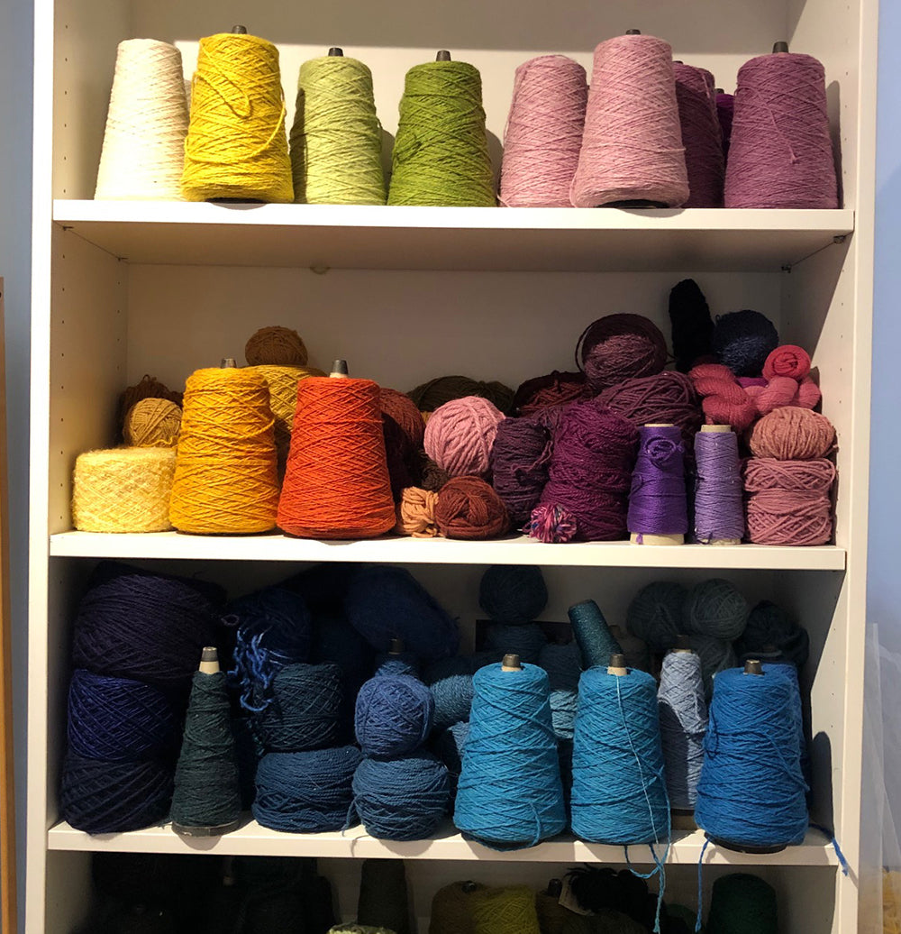 colorful yarns on shelf from green mountain spinnery