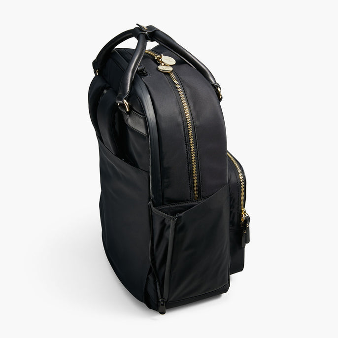 black backpack with gold zippers