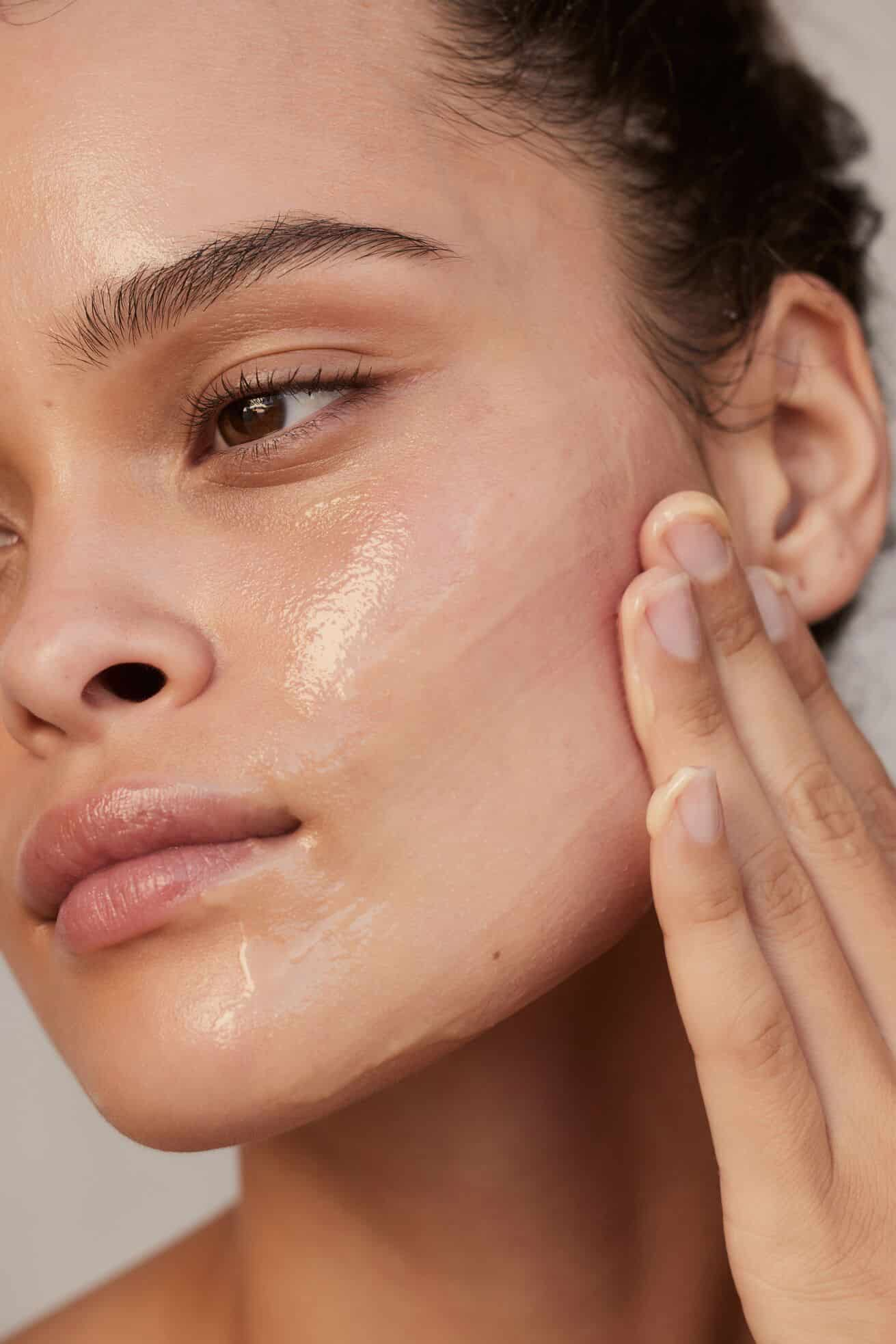 Close up of woman’s face applying Magic Multi-Balm as a mask. 