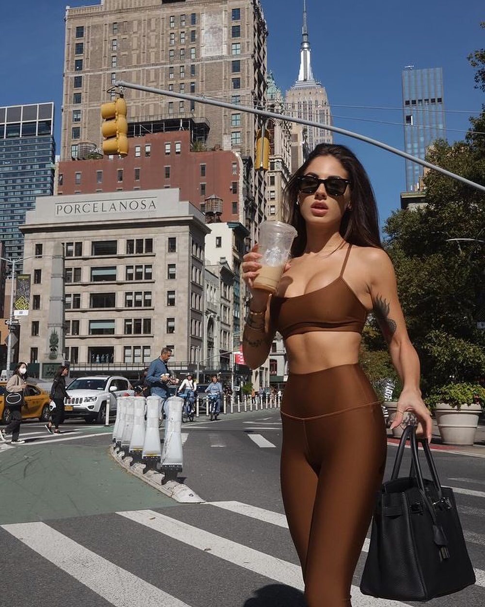 @giuliadelellis wearing all Cinnamon Brown Airlift standing in Madison Square with the Empire State Building in the background 