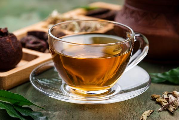 Green tea in a glass mug