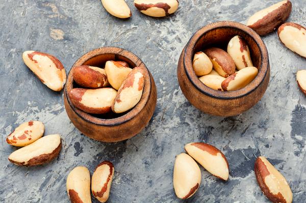 Plant-based foods for fertility - Brazil nuts in little wooden bowls