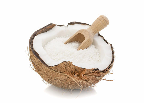 Half a coconut with shredded coconut inside