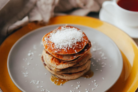Coconut and banana pancakes on a plate