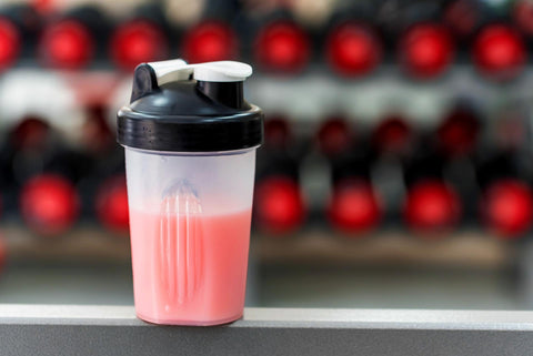 A protein shake on a ledge.