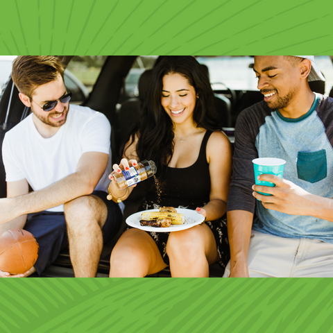 Friends Enjoying food and drinks at a cookout