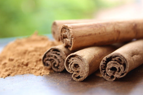 Rolled Ceylon Cinnamon next to Ceylon Cinnamon Powder