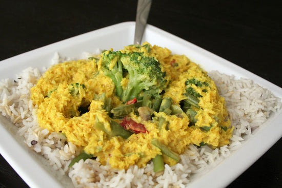 A big plate of rice with coconut curry sauce on top