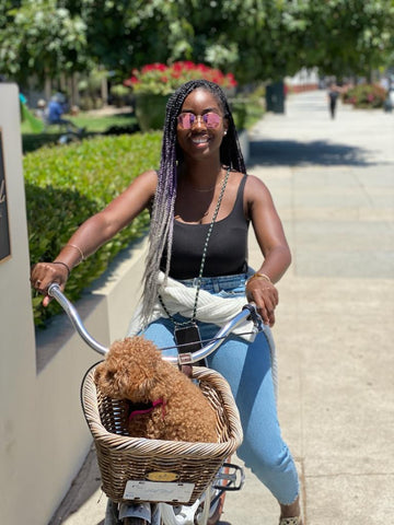 riding a bike with dog and crossbody phone case