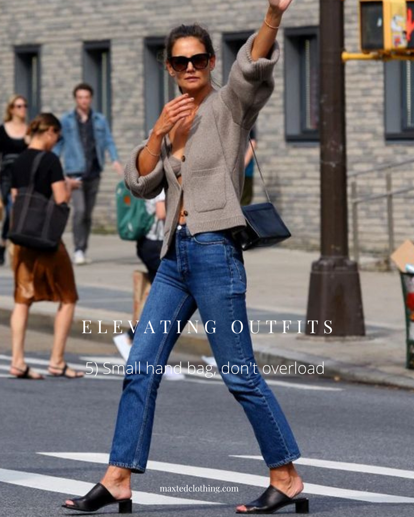 katie holmes carrying a small handbag